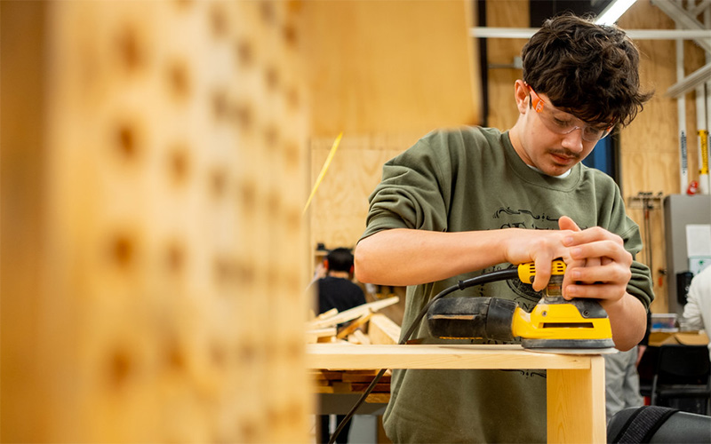 Tacoma Public Schools student building a mason bee habitat.