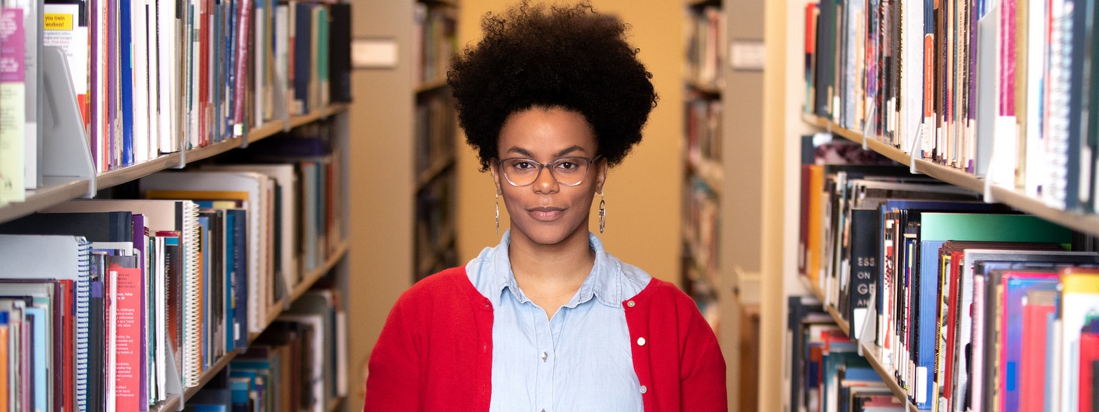 TeyAnjulee Leon in UW Tacoma Library book stacks