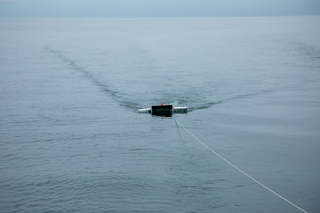 Manta net being towed along surface of Commencement Bay behind SS Adventuress.