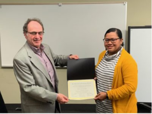 Two people holding a certificate