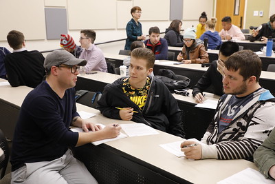 Students discussing in a classroom setting