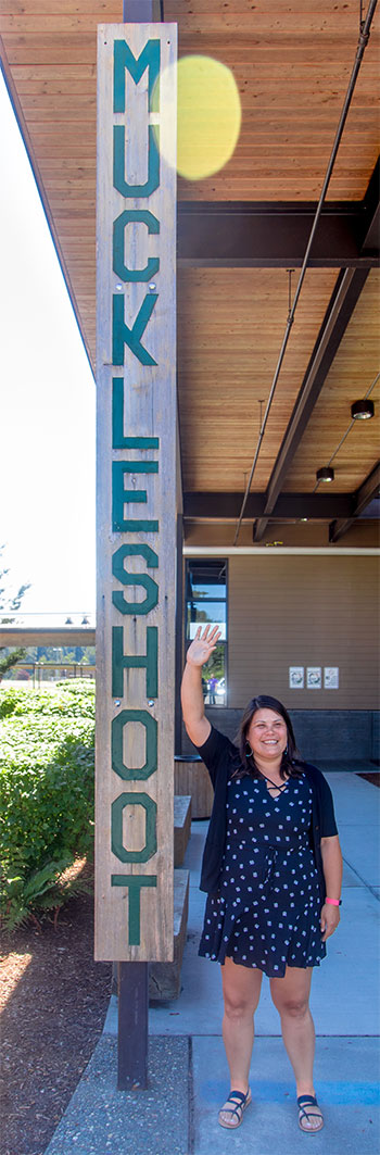 Krystal Adolph, '05, 2018 Distinguished Alumni Award recipient, standing outside the Muckleshoot Tribal School in Auburn, Wash.