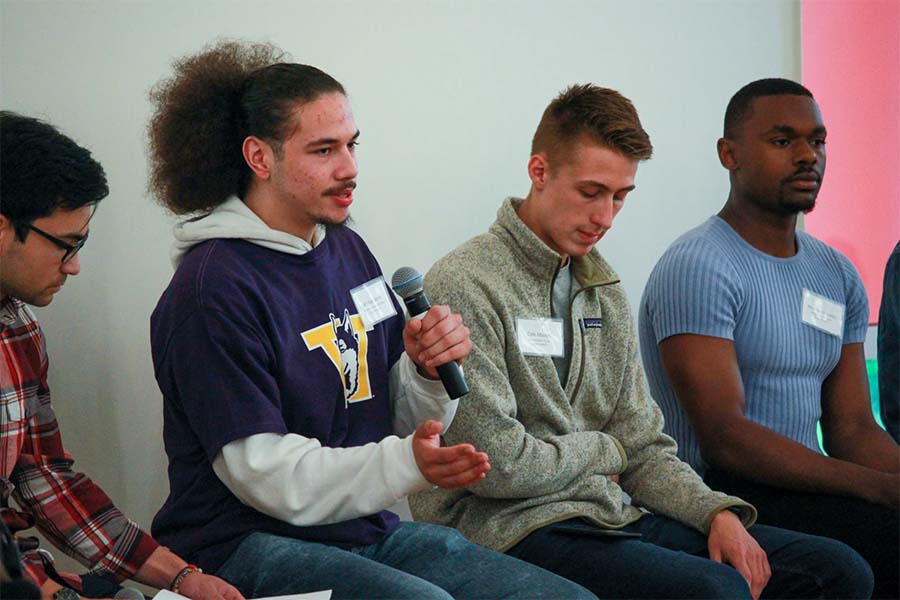 UW Tacoma student Jai'Shon Berry holding microphone.