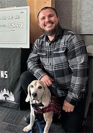 Nathanael Engen, first-prize winner of 2023 VIBE Business Plan Competition, and his dog Bruce Wayne.