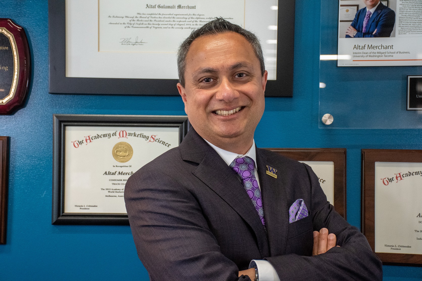 Dean Altaf Merchant inside his office posing for a headshot