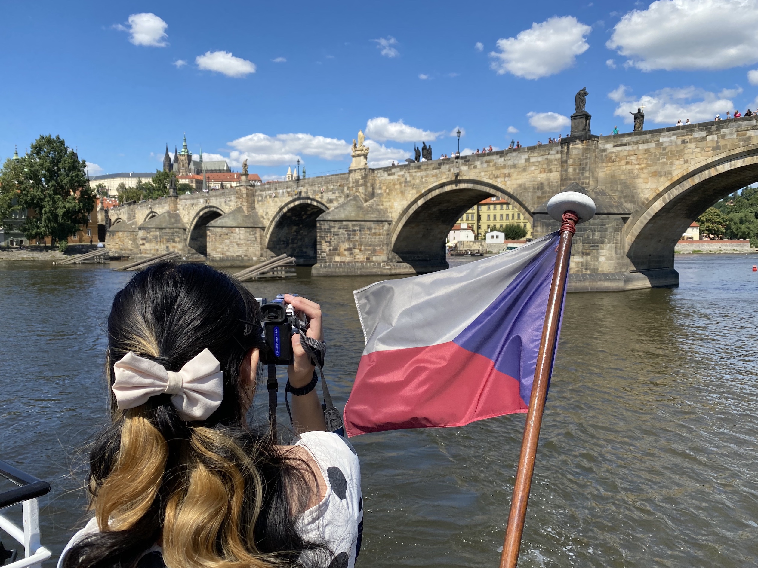 Boat ride in Prague looking over a bridge.