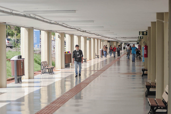 Hallway open to the outside with students walking