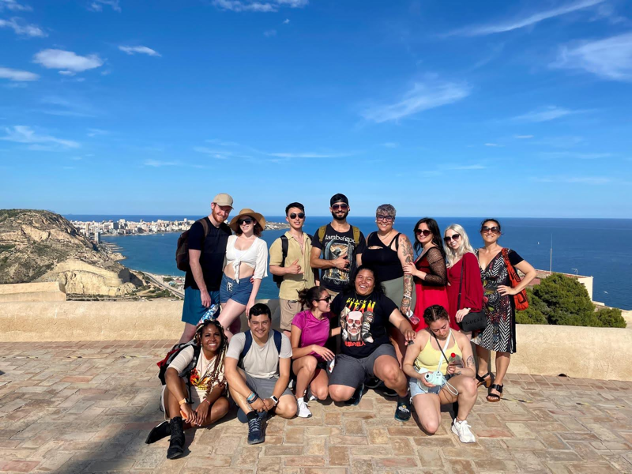 A group of people posing for a photo outside in Alicante, Spain