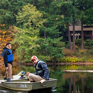 UW Tacoma alumnus Marco Barajas and colleague on Lake Killarney