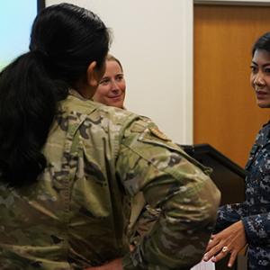 Service members from WA Air National Guard and Royal Thai Air Force talking