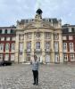 Image of Jovany smiling in front of German building