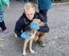 David Pavenko hugging dog in Paraskoviivka, Ukraine.