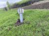 Unexploded rocket embedded in grassy area in eastern Ukraine.