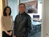 University of Washington Tacoma professors Hui Suk So (left) and Fei Leng (right) stand in front of the new Financial Wellness Center Lab that will be equipped with a stock ticker showing real time financial data and Bloomberg Terminals that students can use to monitor and analyze financial data and trade on the stock market. The lab is the first-of-its-kind within the University of Washington system. So and Leng are the directors of the Center for Financial Wellness at the UW Tacoma business school.