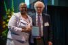 Herb Simon poses with the Chancellor as he accepts his award