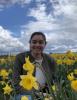 Female Student smiling with flowers