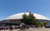 The Tacoma Dome, showing U.S. and W flags flying atop the dome.