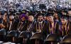 Students waiting for their turn to walk across the stage at the 2024 UW Tacoma Commencement.