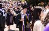 Families and loved ones converge outside the Tacoma Dome after the 2024 UW Tacoma Commencement.